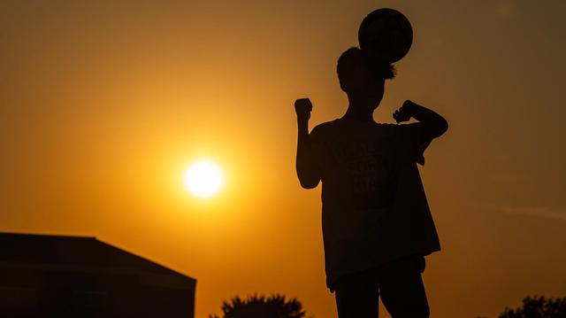Pu Reh, 13, goes for a header while soccer training at Capp Smith Park in Watauga on Thursday, June 27, 2024. Temperatures rose to over 100 degrees as the summer heatwave begins to heat up.
